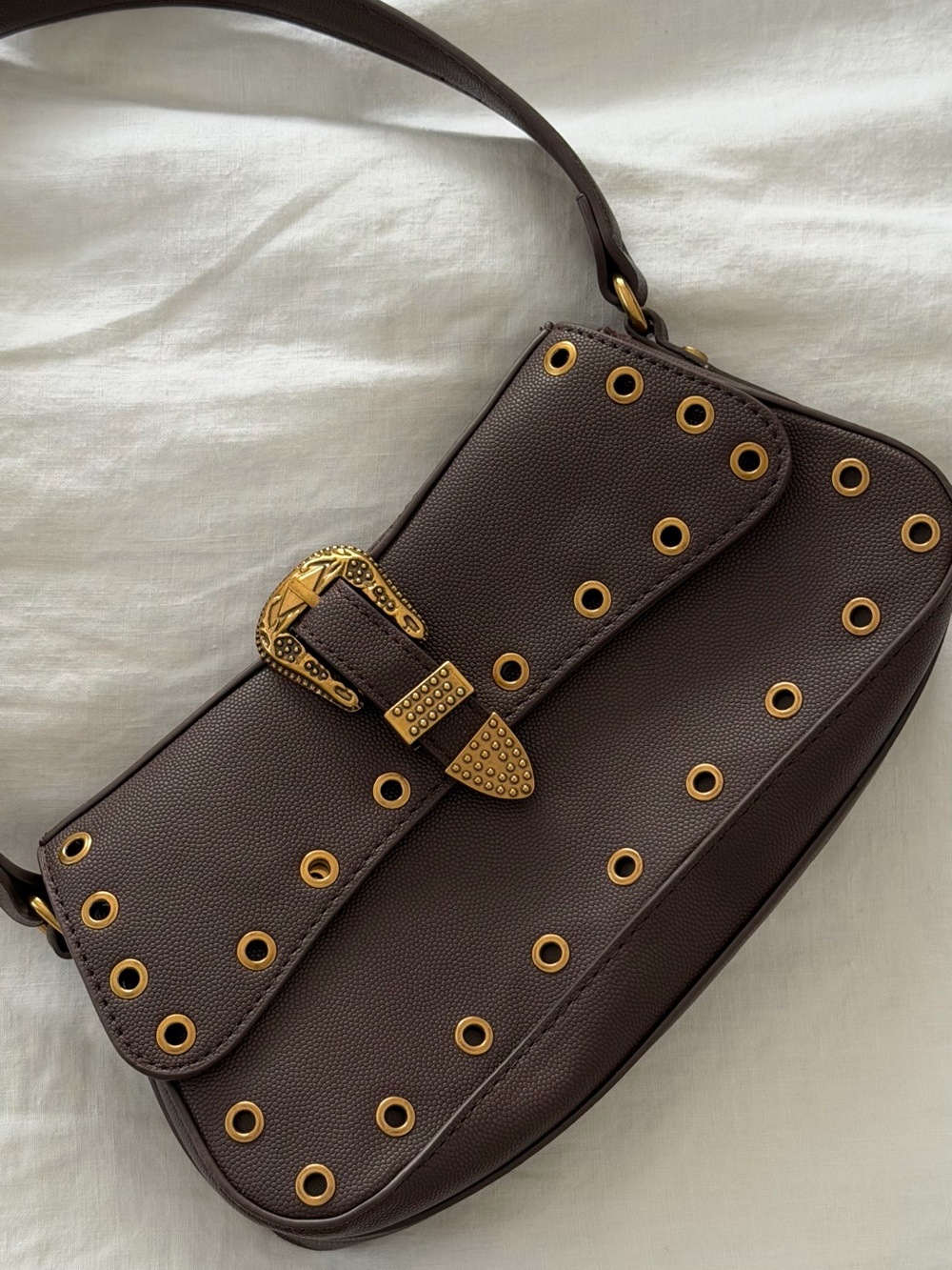 Brown Leather Shoulder Bag with Gold Buckle and Grommet Detail